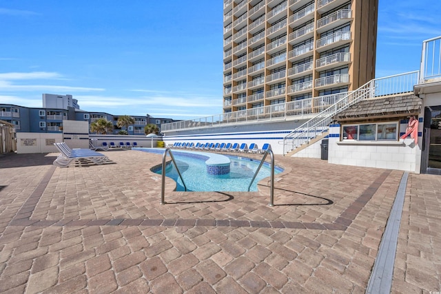 9550 Shore Dr Unit 1537/1538, Myrtle Beach, SC 29572 - community pool featuring stairs and a patio area