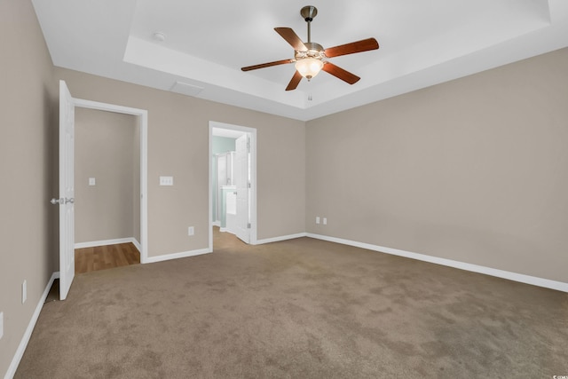 244 Devonbrook Pl, Longs, SC 29568 - unfurnished bedroom featuring a raised ceiling, carpet, a ceiling fan, and ensuite bathroom
