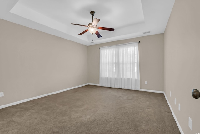 244 Devonbrook Pl, Longs, SC 29568 - empty room featuring a raised ceiling, carpet flooring, and a ceiling fan