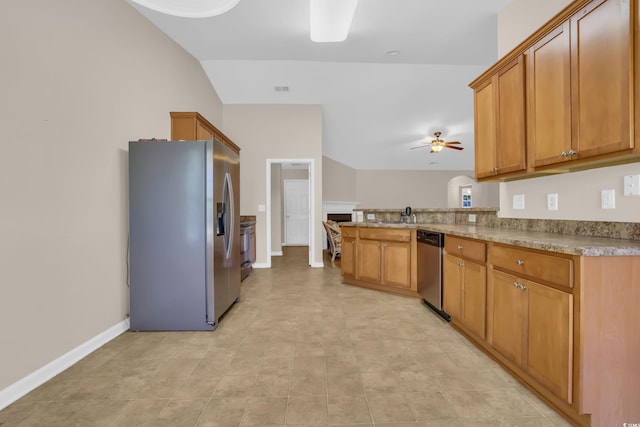 244 Devonbrook Pl, Longs, SC 29568 - kitchen with stainless steel appliances, a ceiling fan, brown cabinets, and a peninsula