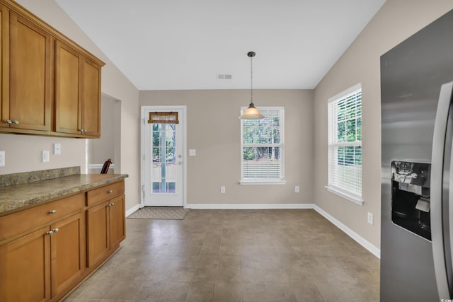 244 Devonbrook Pl, Longs, SC 29568 - kitchen with stainless steel fridge, lofted ceiling, brown cabinets, and hanging light fixtures