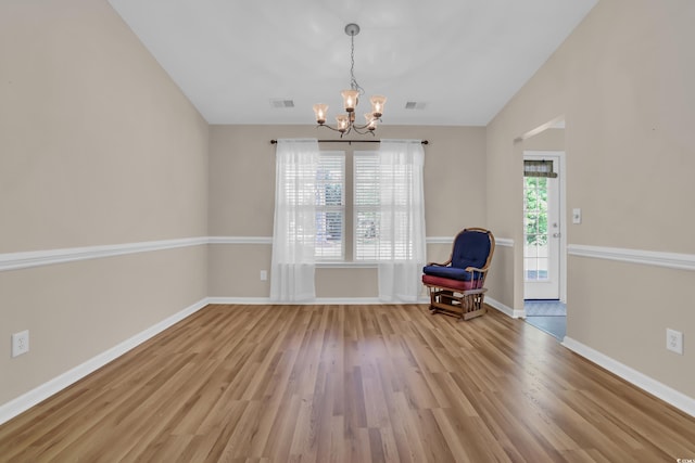 244 Devonbrook Pl, Longs, SC 29568 - unfurnished room with a chandelier, light wood-style floors, and lofted ceiling