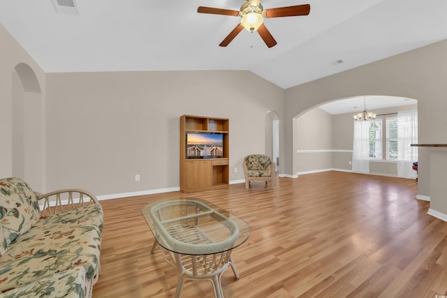 244 Devonbrook Pl, Longs, SC 29568 - living area featuring arched walkways, a chandelier, light wood-style floors, vaulted ceiling, and a ceiling fan