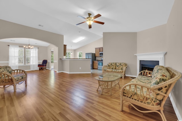 244 Devonbrook Pl, Longs, SC 29568 - living room featuring light wood-style flooring, healthy amount of natural light, ceiling fan, lofted ceiling, and a chandelier