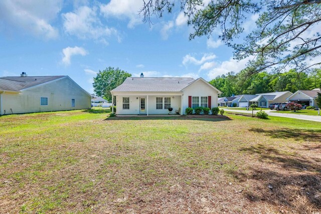 244 Devonbrook Pl, Longs, SC 29568 - rear view of house with a lawn