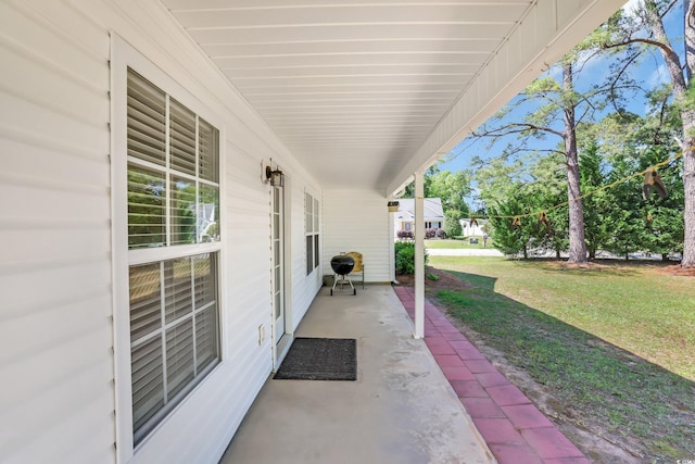 244 Devonbrook Pl, Longs, SC 29568 - covered porch featuring a lawn