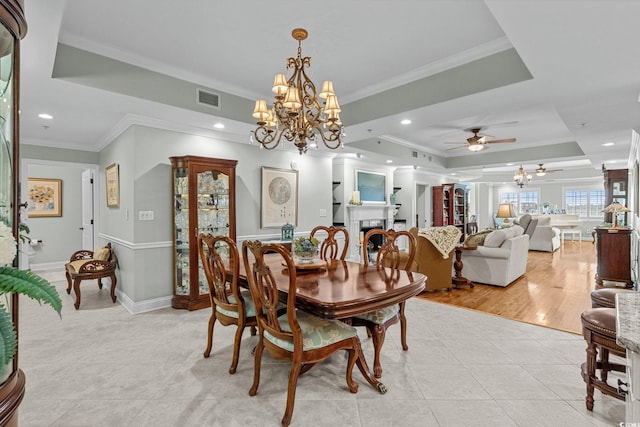 9547 Edgerton Dr Unit 405, Myrtle Beach, SC 29572 - dining space featuring a tray ceiling, a chandelier, ornamental molding, light tile patterned flooring, and recessed lighting