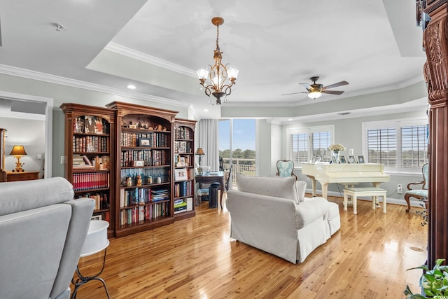 9547 Edgerton Dr Unit 405, Myrtle Beach, SC 29572 - living area featuring ornamental molding, light wood-type flooring, a ceiling fan, recessed lighting, and a tray ceiling