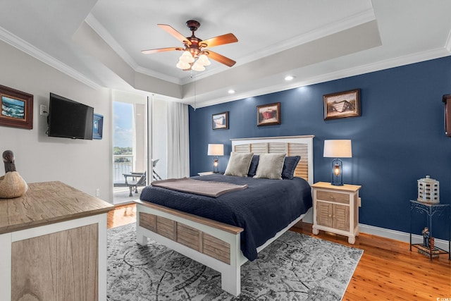 9547 Edgerton Dr Unit 405, Myrtle Beach, SC 29572 - bedroom featuring a raised ceiling, ornamental molding, light wood-style flooring, a ceiling fan, and recessed lighting