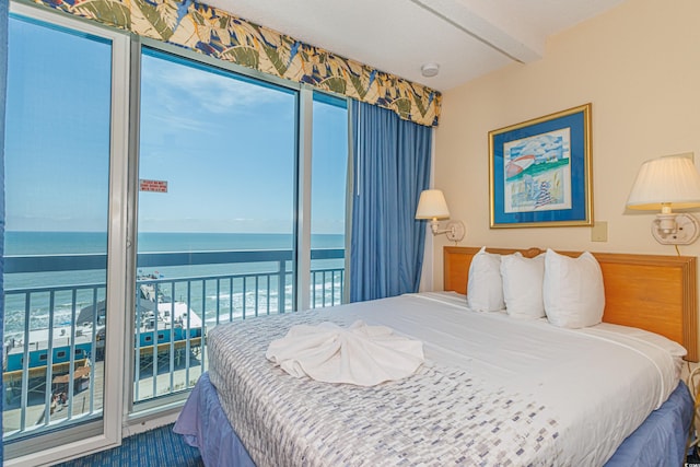 1304 N Ocean Blvd Unit 1104, Myrtle Beach, SC 29577 - carpeted bedroom featuring a water view and access to exterior