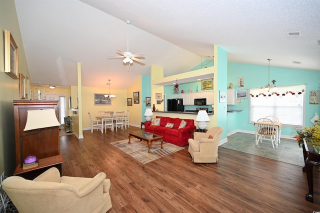 144 Balsa Dr, Longs, SC 29568 - living area featuring lofted ceiling, a ceiling fan, dark wood-type flooring, and a chandelier