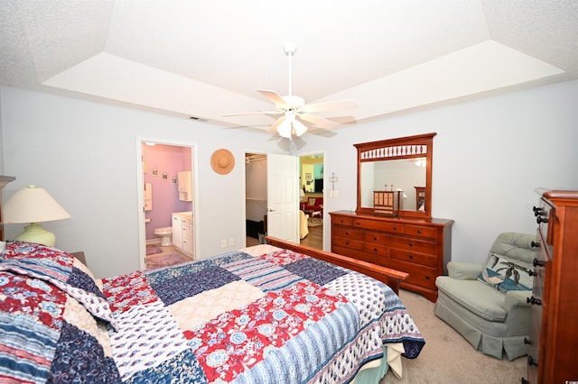 144 Balsa Dr, Longs, SC 29568 - bedroom with a raised ceiling, light carpet, ensuite bath, ceiling fan, and a walk in closet