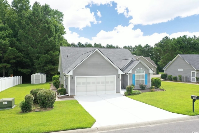 144 Balsa Dr, Longs, SC 29568 - view of front of property with a storage unit, an attached garage, driveway, and roof with shingles