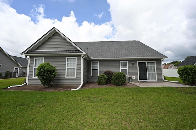 144 Balsa Dr, Longs, SC 29568 - back of property featuring a patio area, a shingled roof, and a yard
