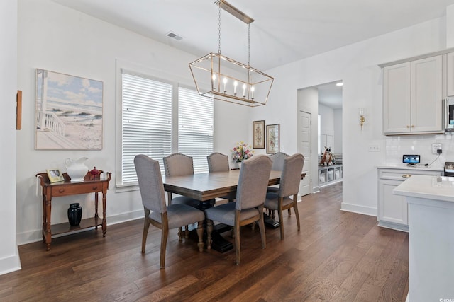 1524 Sayebrook Pkwy, Myrtle Beach, SC 29588 - dining space with a chandelier, healthy amount of natural light, and dark wood-type flooring
