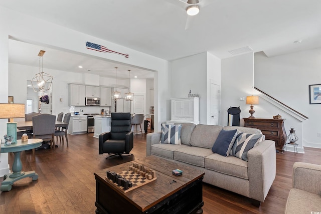 1524 Sayebrook Pkwy, Myrtle Beach, SC 29588 - living area featuring dark wood-style flooring, a chandelier, and a ceiling fan