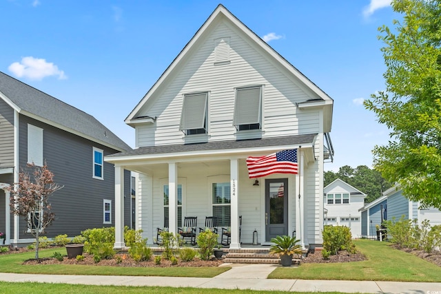 1524 Sayebrook Pkwy, Myrtle Beach, SC 29588 - view of front of property featuring covered porch, a front lawn, and roof with shingles