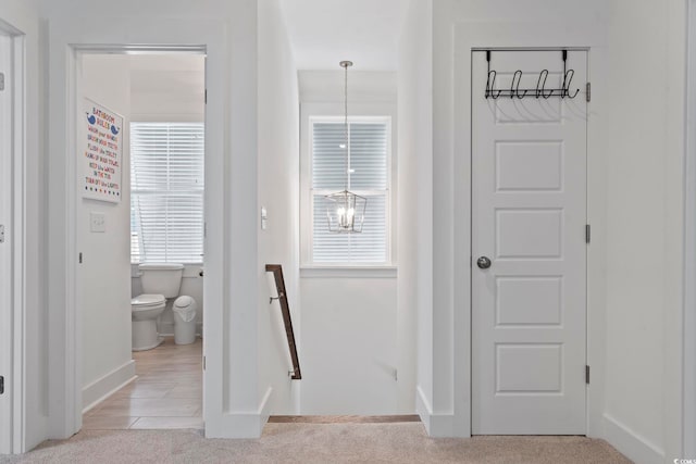 1524 Sayebrook Pkwy, Myrtle Beach, SC 29588 - hallway with an upstairs landing, plenty of natural light, and light colored carpet