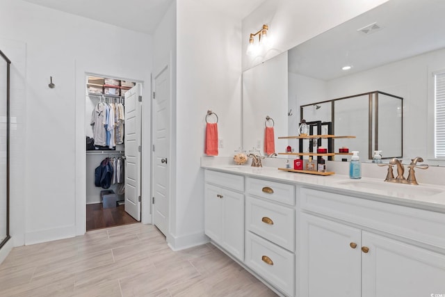 1524 Sayebrook Pkwy, Myrtle Beach, SC 29588 - bathroom featuring a shower stall, double vanity, and a walk in closet
