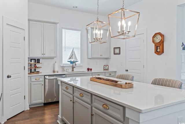 1524 Sayebrook Pkwy, Myrtle Beach, SC 29588 - kitchen featuring stainless steel dishwasher, a chandelier, a kitchen island, dark wood finished floors, and light countertops