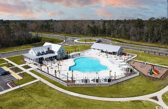 1524 Sayebrook Pkwy, Myrtle Beach, SC 29588 - aerial view at dusk of view of pool and a view of trees