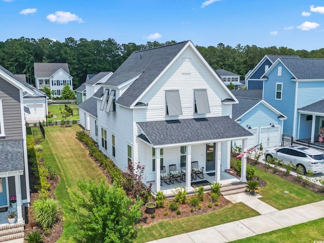 1524 Sayebrook Pkwy, Myrtle Beach, SC 29588 - view of front of home with a shingled roof, covered porch, a front lawn, and a residential view