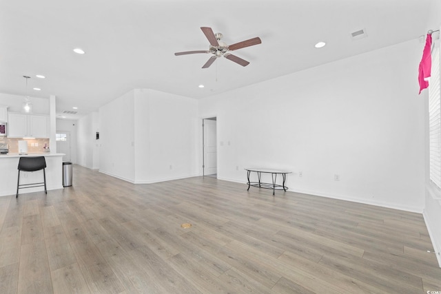 219 Glenmoor Dr, Conway, SC 29526 - unfurnished living room with a ceiling fan, recessed lighting, and light wood-style floors