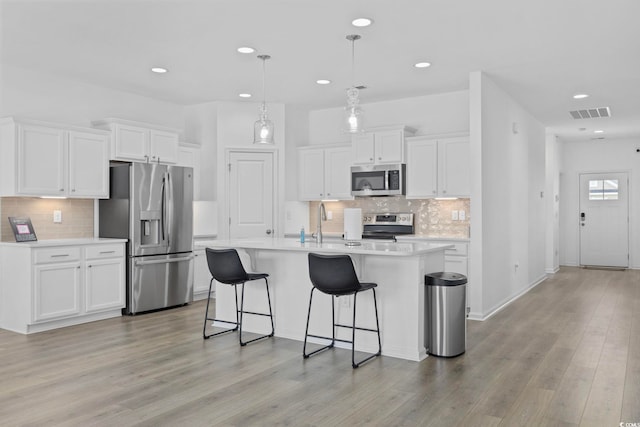 219 Glenmoor Dr, Conway, SC 29526 - kitchen featuring stainless steel appliances, light countertops, decorative backsplash, white cabinetry, and recessed lighting
