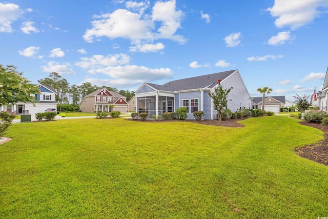 219 Glenmoor Dr, Conway, SC 29526 - rear view of house featuring a sunroom and a lawn