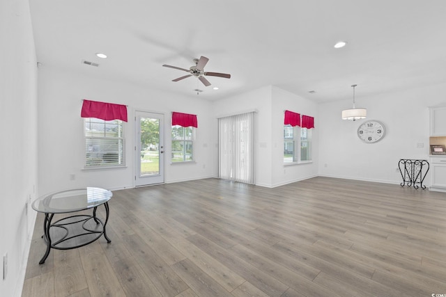 219 Glenmoor Dr, Conway, SC 29526 - unfurnished living room featuring healthy amount of natural light, light wood-style flooring, recessed lighting, and a ceiling fan