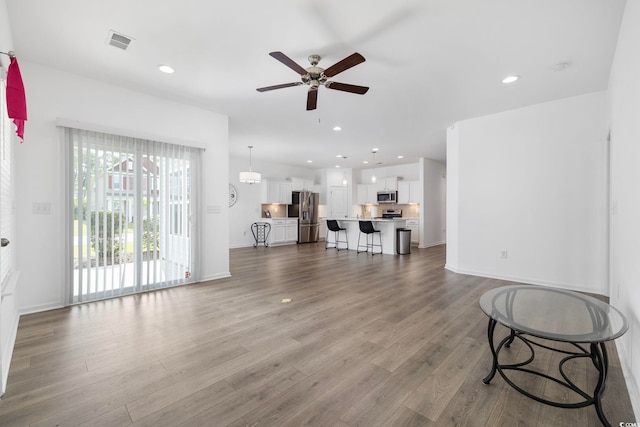 219 Glenmoor Dr, Conway, SC 29526 - living room with ceiling fan, wood finished floors, and recessed lighting