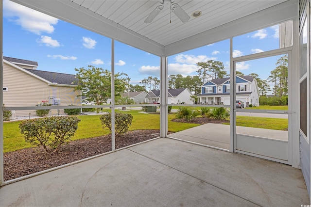 219 Glenmoor Dr, Conway, SC 29526 - unfurnished sunroom featuring a ceiling fan, a residential view, and healthy amount of natural light
