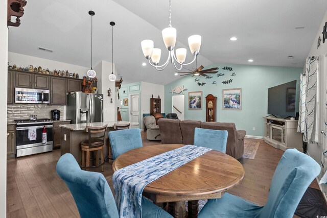 2781 Desert Rose St, Little River, SC 29566 - dining room with lofted ceiling, dark wood-style flooring, a ceiling fan, a chandelier, and recessed lighting