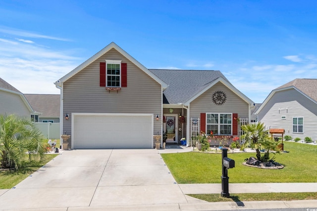 2781 Desert Rose St, Little River, SC 29566 - traditional home featuring an attached garage, a front lawn, concrete driveway, and stone siding