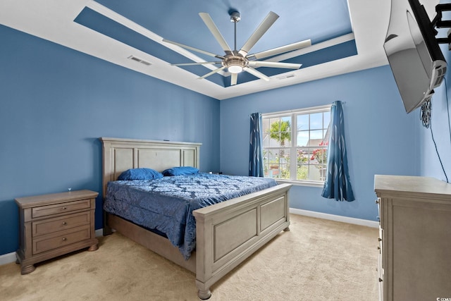 2781 Desert Rose St, Little River, SC 29566 - bedroom featuring light colored carpet, a tray ceiling, and a ceiling fan
