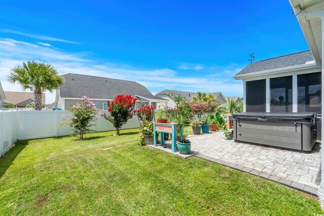 2781 Desert Rose St, Little River, SC 29566 - fenced backyard featuring a patio area, a hot tub, and a sunroom