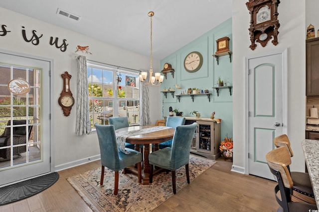 2781 Desert Rose St, Little River, SC 29566 - dining space featuring a chandelier and light wood-style flooring