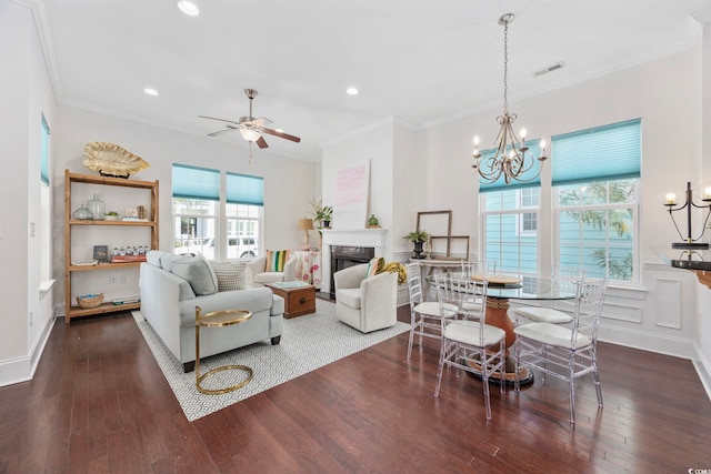 1348 Peterson St, Myrtle Beach, SC 29577 - living area featuring a high end fireplace, dark wood finished floors, a chandelier, crown molding, and ceiling fan