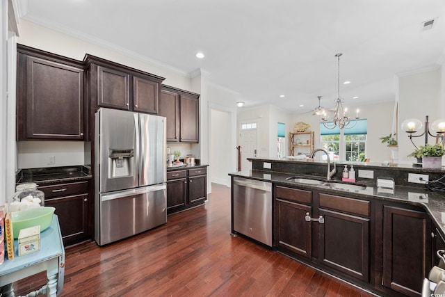 1348 Peterson St, Myrtle Beach, SC 29577 - kitchen featuring stainless steel appliances, a chandelier, dark brown cabinets, dark stone counters, and recessed lighting