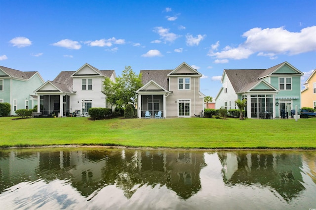 5304 Sea Coral Way N, Myrtle Beach, SC 29582 - back of house featuring a sunroom, a lawn, a water view, and a residential view