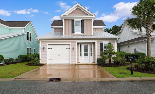 5304 Sea Coral Way N, Myrtle Beach, SC 29582 - traditional home with board and batten siding, a front lawn, a metal roof, concrete driveway, and a garage