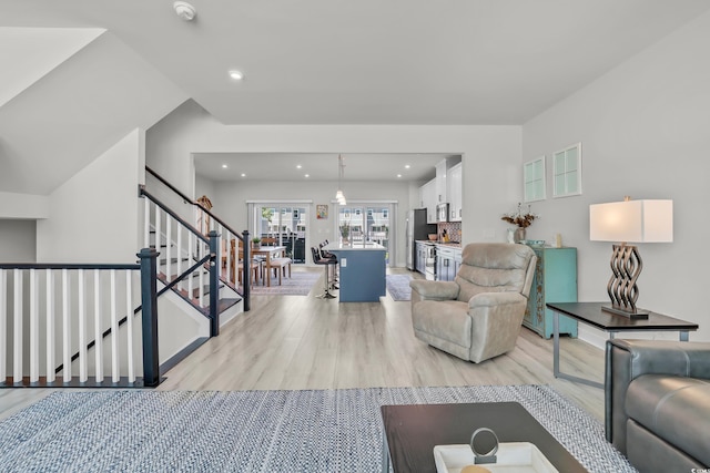2557 Pete Dye Dr Unit 803, North Myrtle Beach, SC 29582 - living room with light wood-style floors, recessed lighting, and stairs