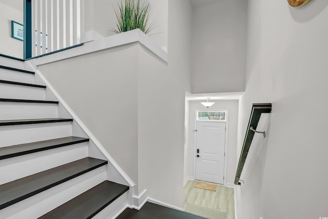 2557 Pete Dye Dr Unit 803, North Myrtle Beach, SC 29582 - foyer with stairs, wood finished floors, and a towering ceiling