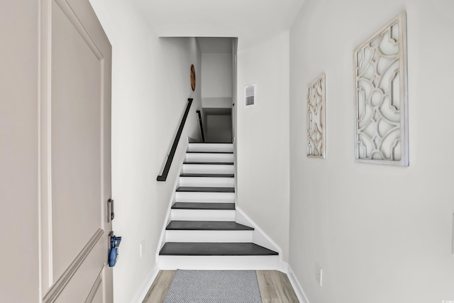 2557 Pete Dye Dr Unit 803, North Myrtle Beach, SC 29582 - stairway featuring wood finished floors and baseboards