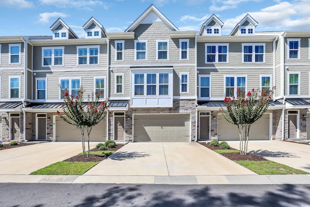 2557 Pete Dye Dr Unit 803, North Myrtle Beach, SC 29582 - townhome / multi-family property featuring driveway, an attached garage, and stone siding