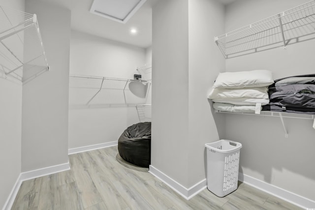 2557 Pete Dye Dr Unit 803, North Myrtle Beach, SC 29582 - walk in closet with wood finished floors and attic access