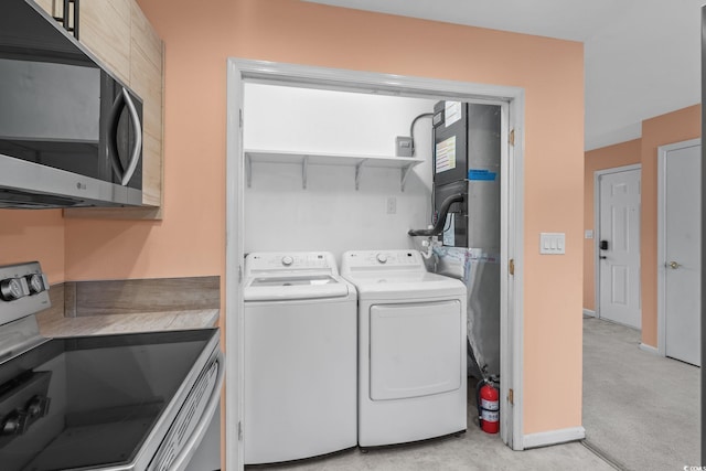 251 Myrtle Greens Dr Unit B, Conway, SC 29526 - laundry room featuring washing machine and clothes dryer and light carpet