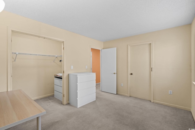 251 Myrtle Greens Dr Unit B, Conway, SC 29526 - unfurnished bedroom with light colored carpet, a textured ceiling, and a closet