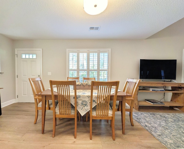 50 Pawleys Place Dr Unit 50, Pawleys Island, SC 29585 - dining space with plenty of natural light, light wood-type flooring, and a textured ceiling