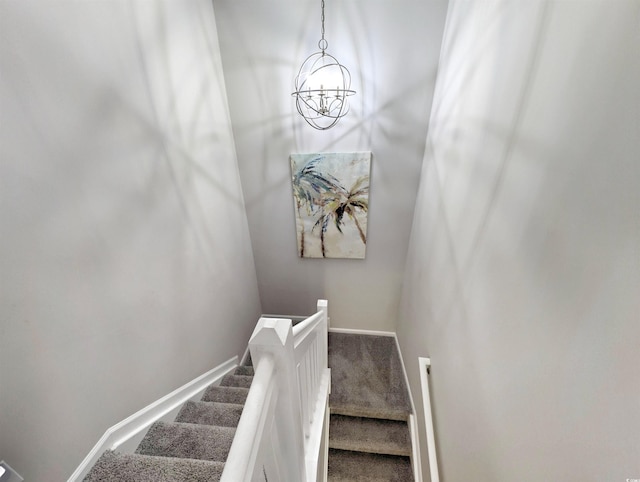 50 Pawleys Place Dr Unit 50, Pawleys Island, SC 29585 - staircase featuring a chandelier and carpet flooring